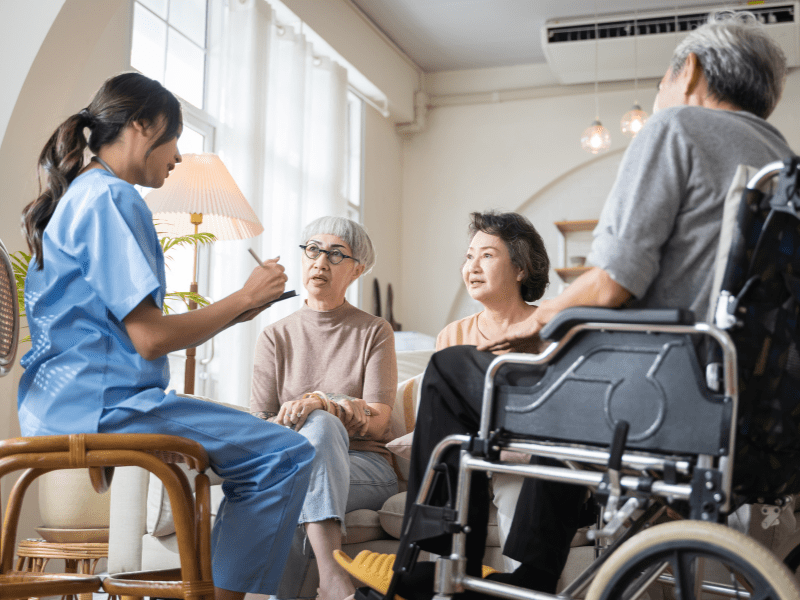 Caregiver Discussing with Patient's Family
